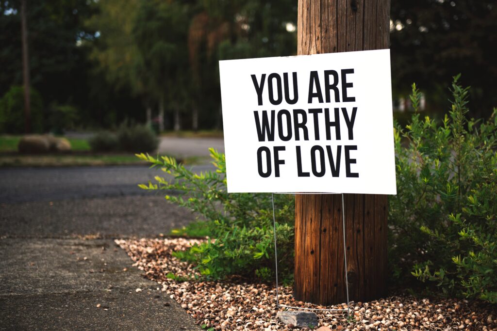 Sign with "you are worthy of love"